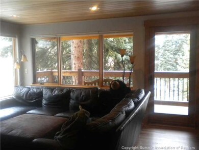 Living Room. Spacious w/ wraparound windows lookin
