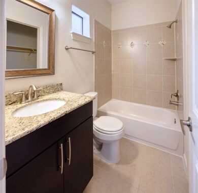 The bathroom in the bottom floor bedroom features