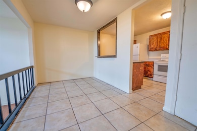 Interior space with light tile patterned flooring,