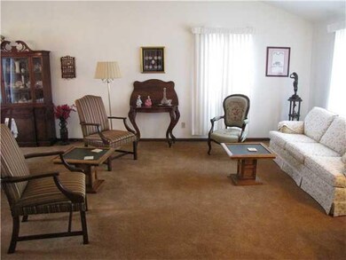 Living Room. Vaulted ceiling and lots of windows m