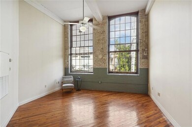 Beautiful double windows overlooking the lush cour