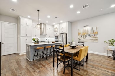 Dining room with recessed lighting, visible vents,