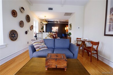 Open living area with wood finished floors