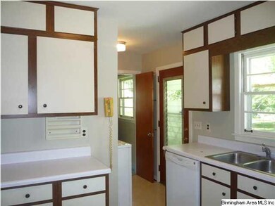 Look at all of those cabinets! Louvered door that 