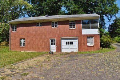 Back Side of House/Basement Garage