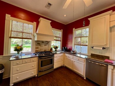 Kitchen with stainless steel appliances, custom ra