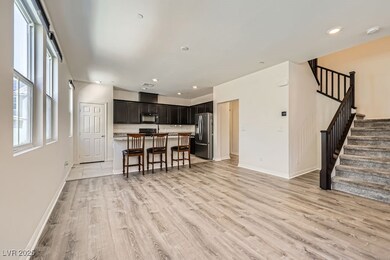 Living room with baseboards, light wood finished f