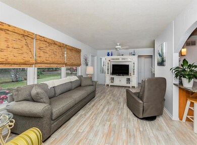 Inviting living room with laminate flooring provid