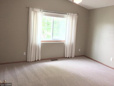 Vaulted master bedroom with a large walk-in closet