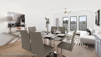 Dining room with light wood-style flooring, recessed lighting, and ceiling fan