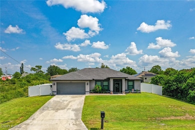 View of front of house featuring stucco siding, an