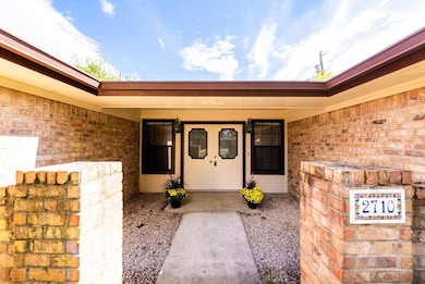 Property entrance with brick siding