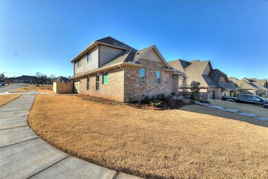 View of side of home featuring a shingled roof, a 