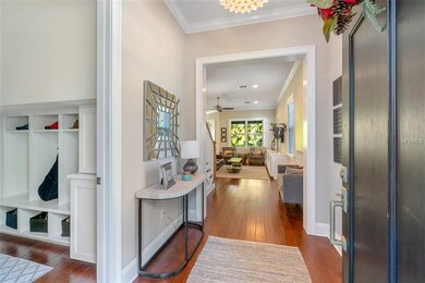 front entry. mudroom with built ins on left lead to garage