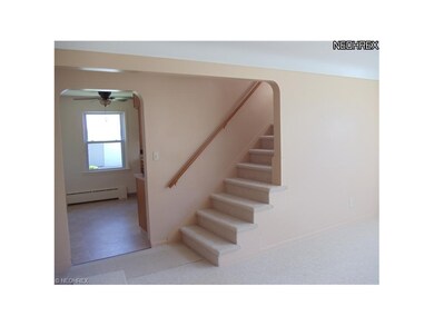 STAIRWAY TO THE UPSTAIRS LIVING AREA. NEW CARPETIN