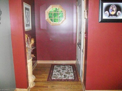 Foyer entry with wood floors