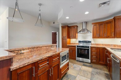 Kitchen featuring appliances with stainless steel