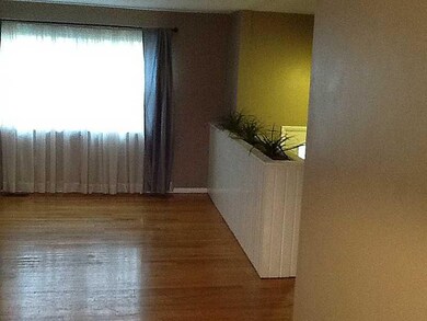 Living Room. Well lit living room with hardwood fl
