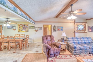 Living area with light tile patterned floors, base