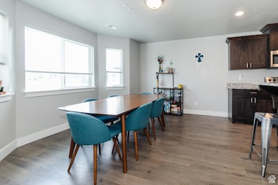 Dining room featuring wood finished floors and recessed lighting