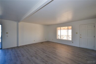 Unfurnished living room with wood-type flooring