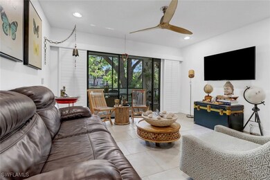 Living room with tiled floors, plantation shutters