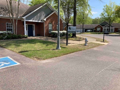 View of front of house featuring brick siding and 