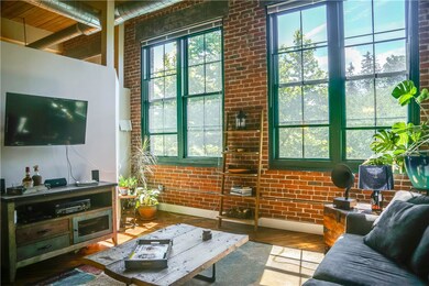 The living room provides an abundance of natural l
