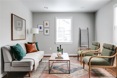 Living room with hardwood / wood-style floors and