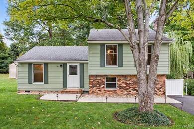 Tri-level home with a front yard
