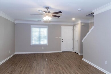 Foyer featuring wood finished floors, crown molding, a ceiling fan, and recessed lighting