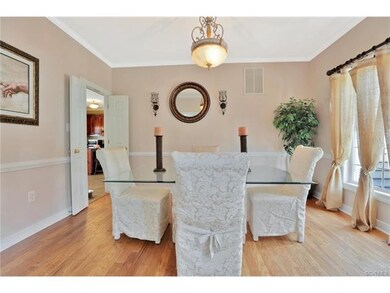Formal living room has lovely wood floors