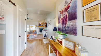 Corridor featuring light wood-style flooring and recessed lighting