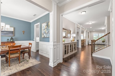 From the moment you walk in, the hardwood floors, tall ceilings, and detailed trim work make this home feel both grand and welcoming.
