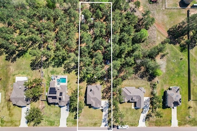 This aerial view highlights the estimated lot line
