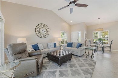 Living room featuring a ceiling fan, light tile patterned flooring, high vaulted ceiling, and recessed lighting