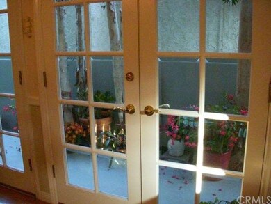 Custom French doors throughout and custom wood molding. Again, notice attention to detail. These doors open to walkway that leads to back-yard patio. 