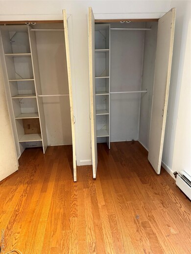 Closet featuring a baseboard heating unit