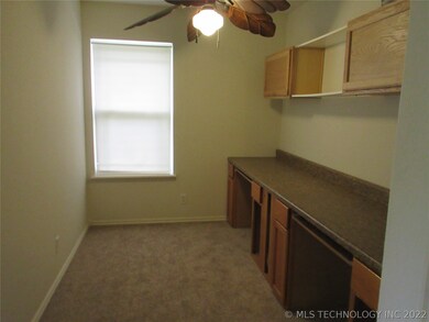 Office area or computer desk area near the bedroom