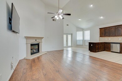A Soaring Ceiling Creates Spaciousness In This Ope