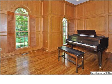 Living Room with coffered wood paneled walls