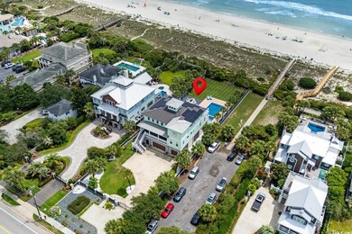 Aerial view of property's location featuring expansive coastline and nearby suburban area