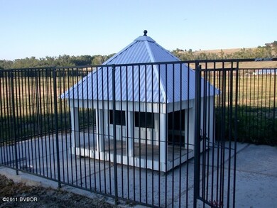 Protected dog enclosure with house