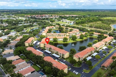 Aerial view of property and surrounding area featuring a large body of water
