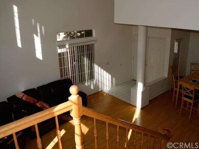 Looking downstairs into living room and formal din