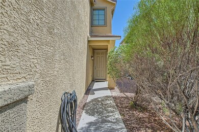 View of exterior entry featuring stucco siding