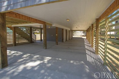large covered parking area under house