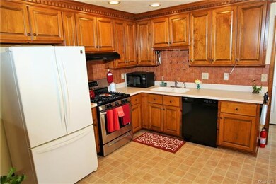 Kitchen with updated cabinets, solid Corian counte
