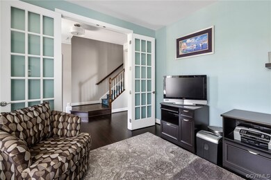 Office with glass French doors, recessed lighting,