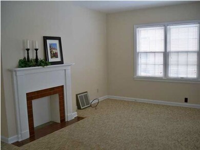 Living Room with ornamental fireplace.